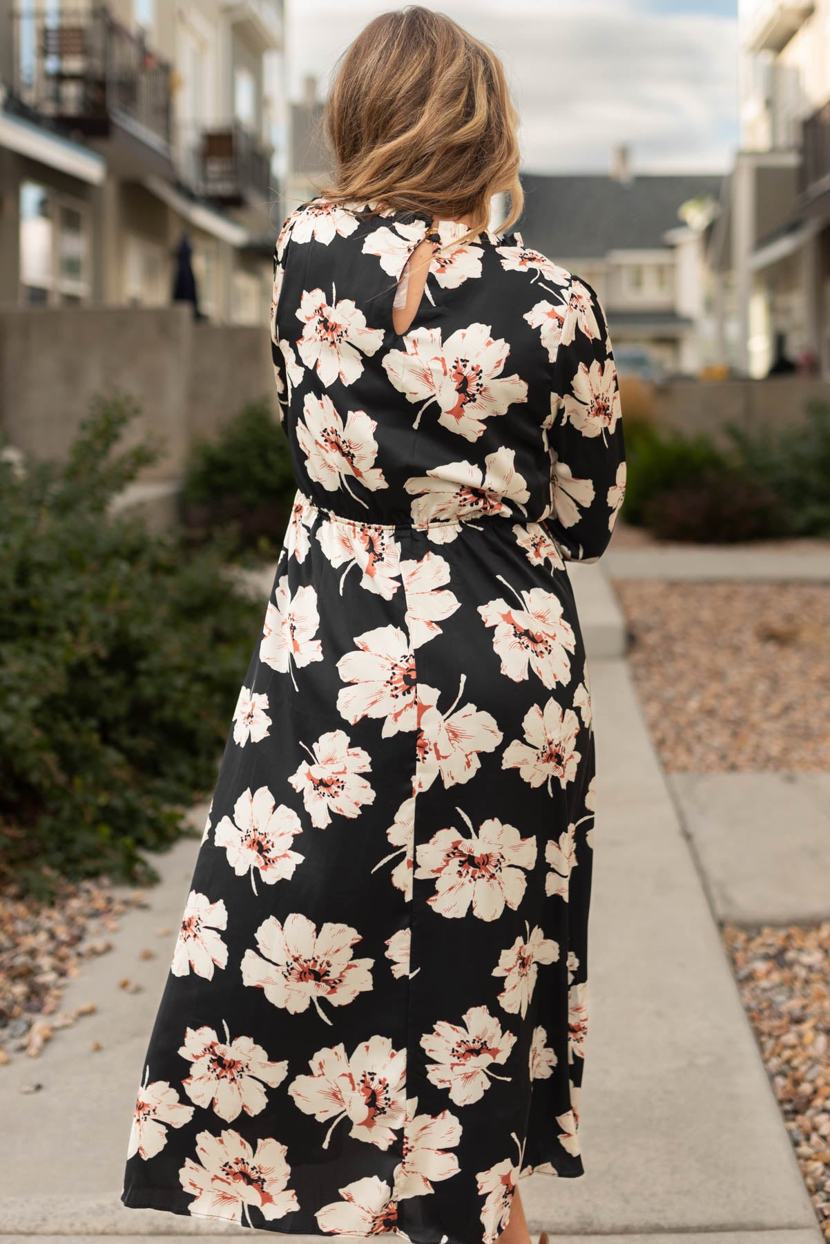 Back view of a black floral maxi dress