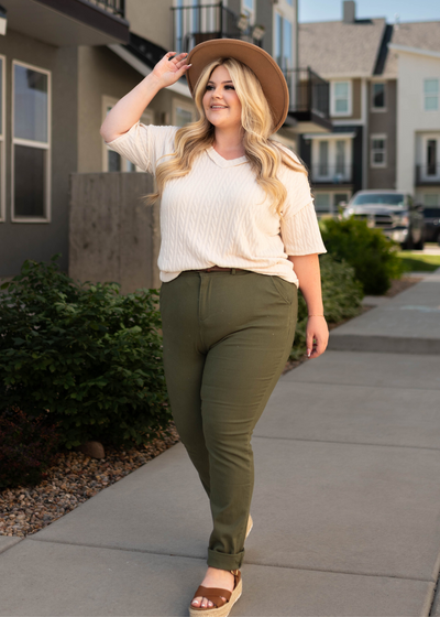Plus size short sleeve cream top with plus size olive pants that are sold separately