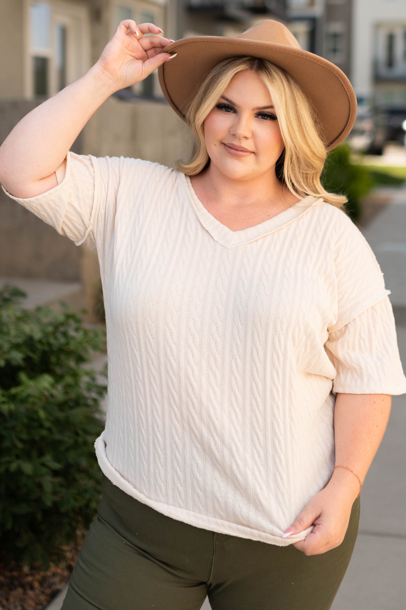 Short sleeve plus size cream top with a v-neck