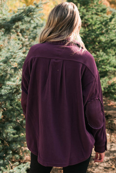 Back view of a dark plum shacket