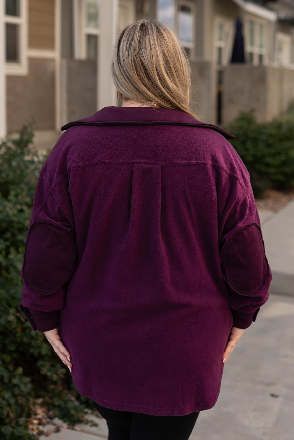 Back view of a dark plum shacket