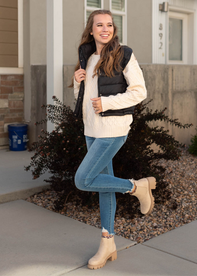 Long sleeve oatmeal sweater with a black vest that is sold separately 