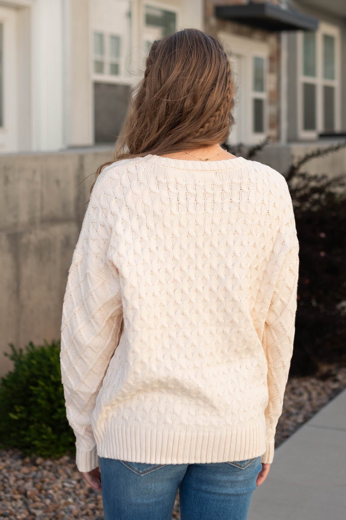 Back view of a oatmeal sweater