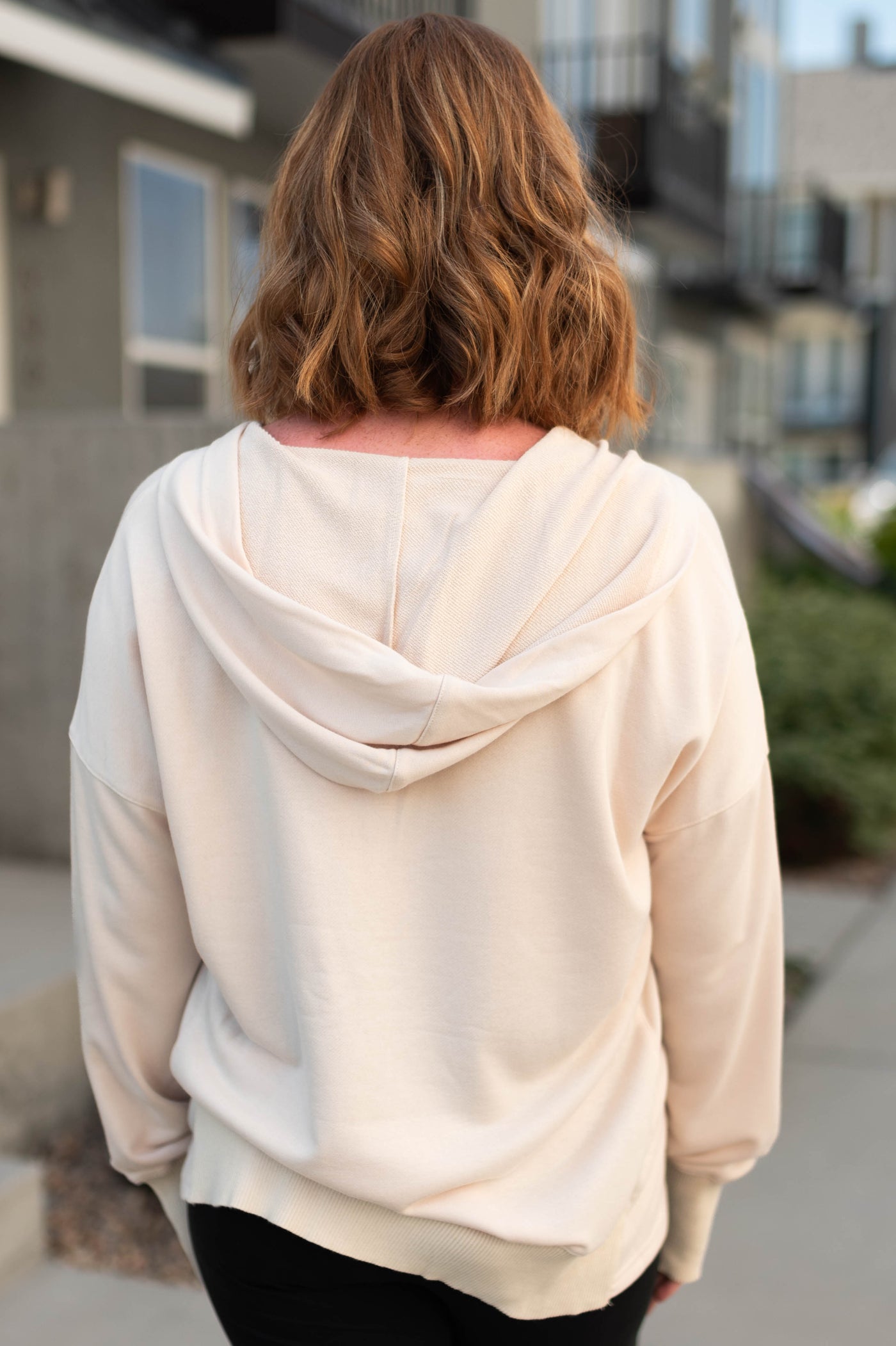Back view of a oatmeal hoodie