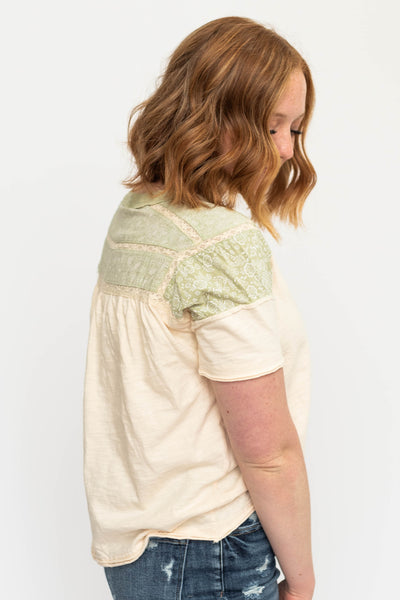 Green tea trim on a cream top
