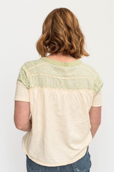 Short sleeve cream top with green tea detail