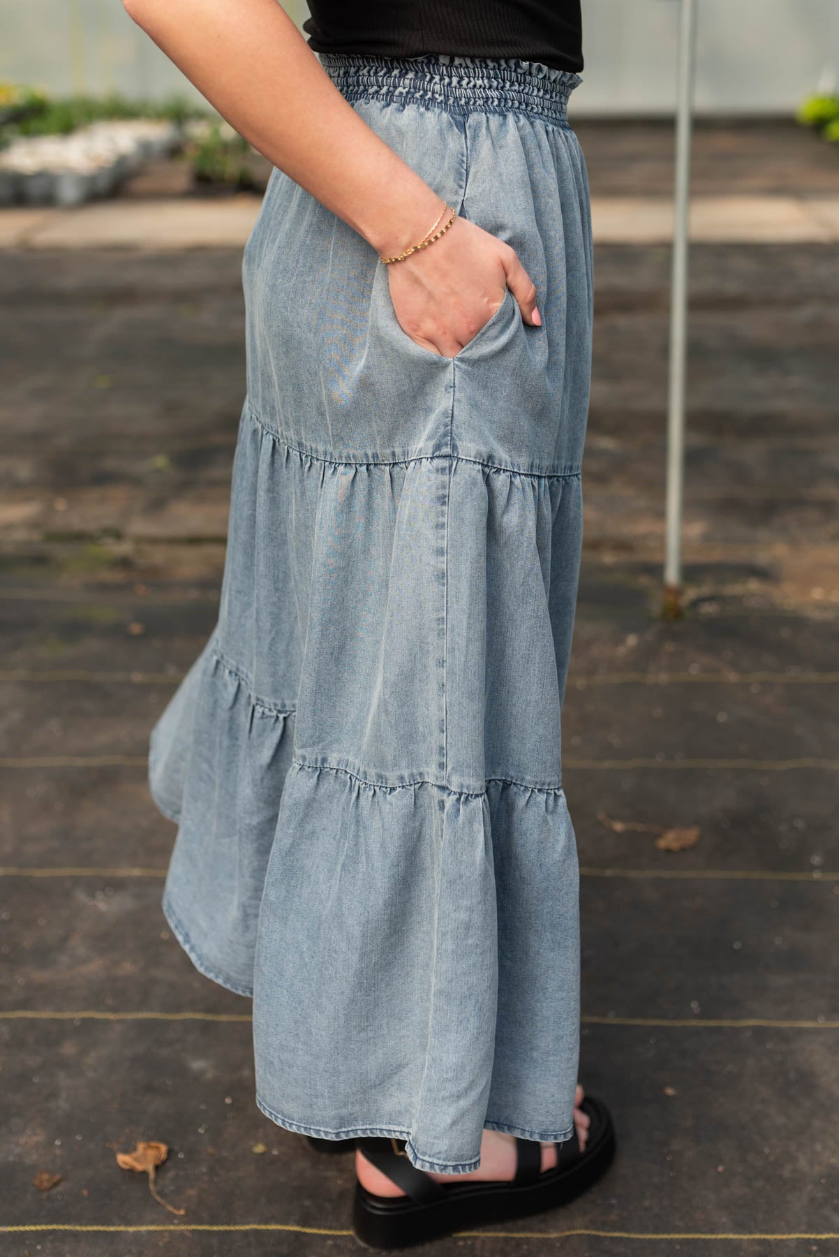 Side view of the denim blue tiered skirt