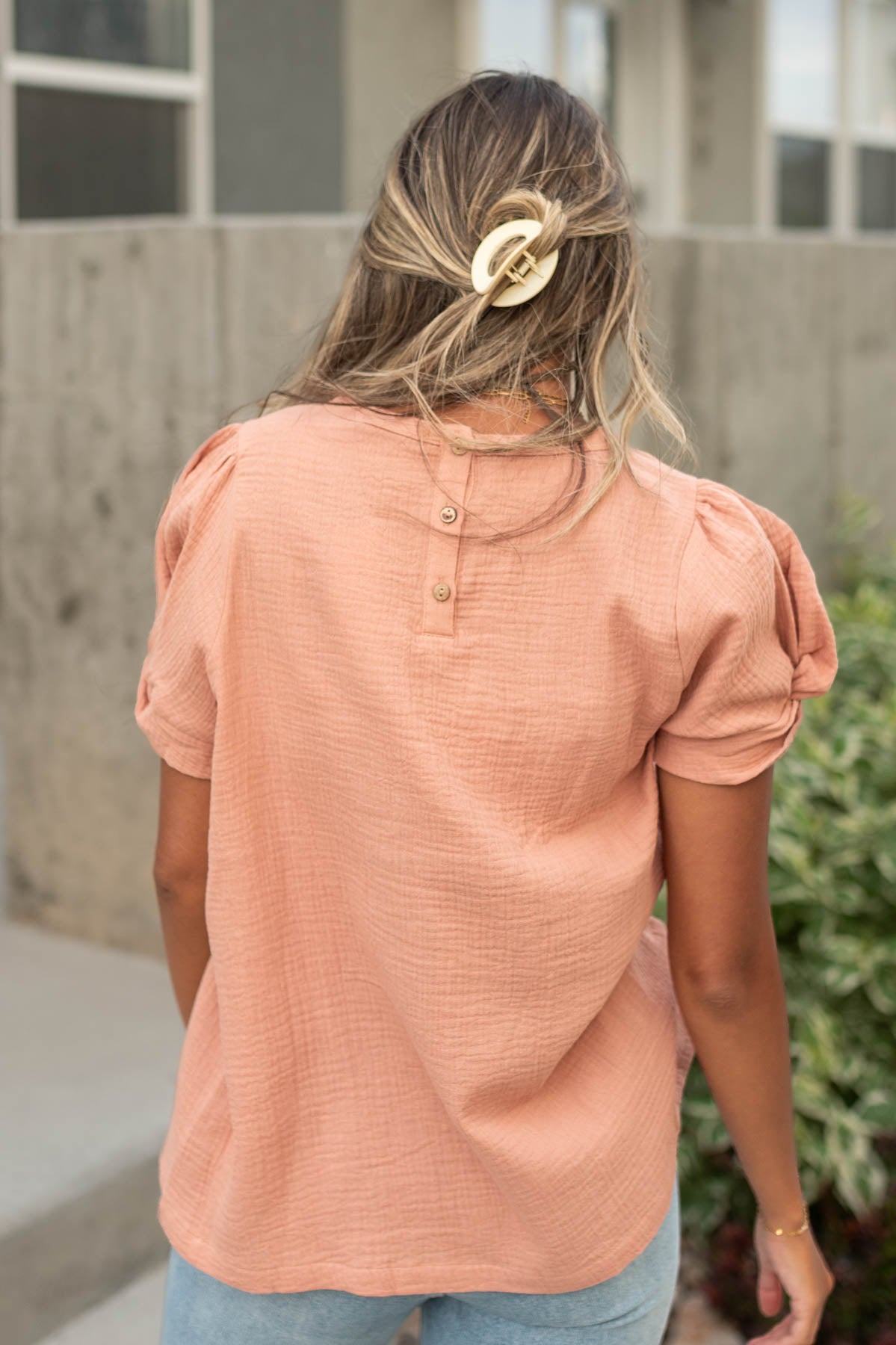 Back view of a dusty coral top