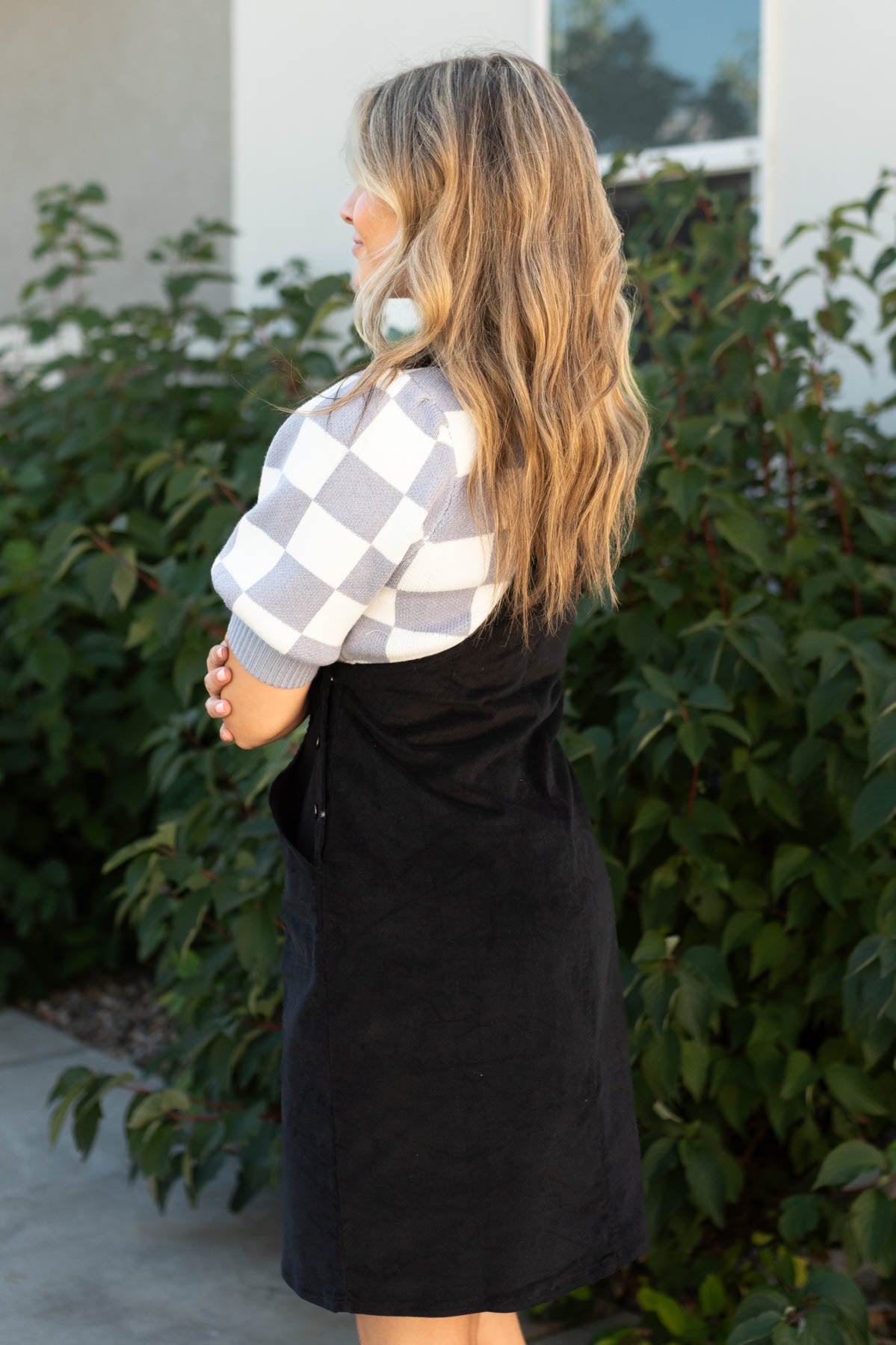 Side view of a overall black dress