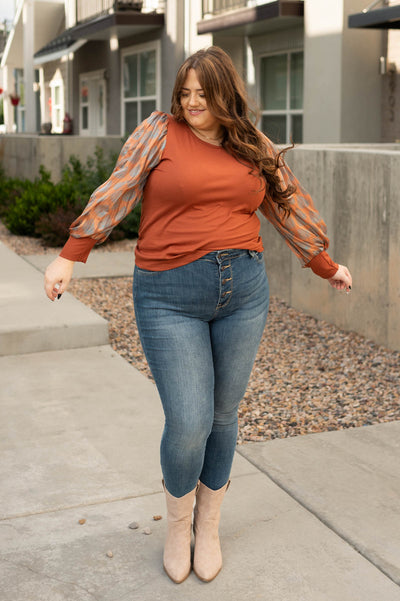 Plus size rust top with pattern sheer sleeves