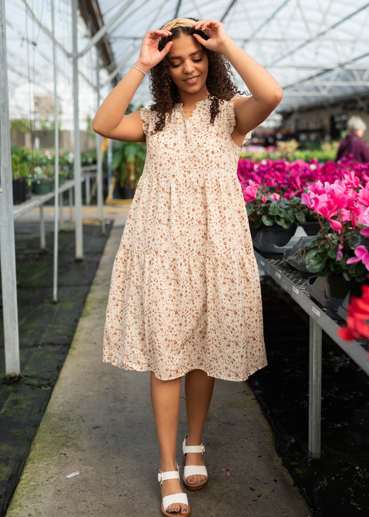 Beige floral dress with a ruffle at the sleeve