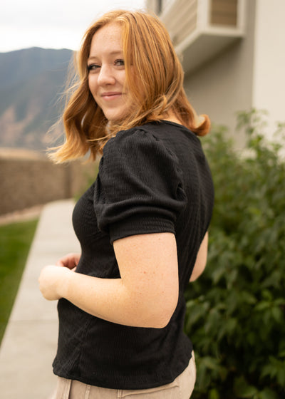 Side view of a black top