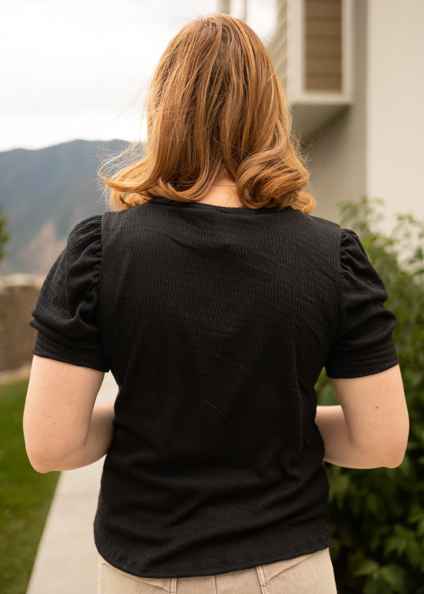 Back view of a black top