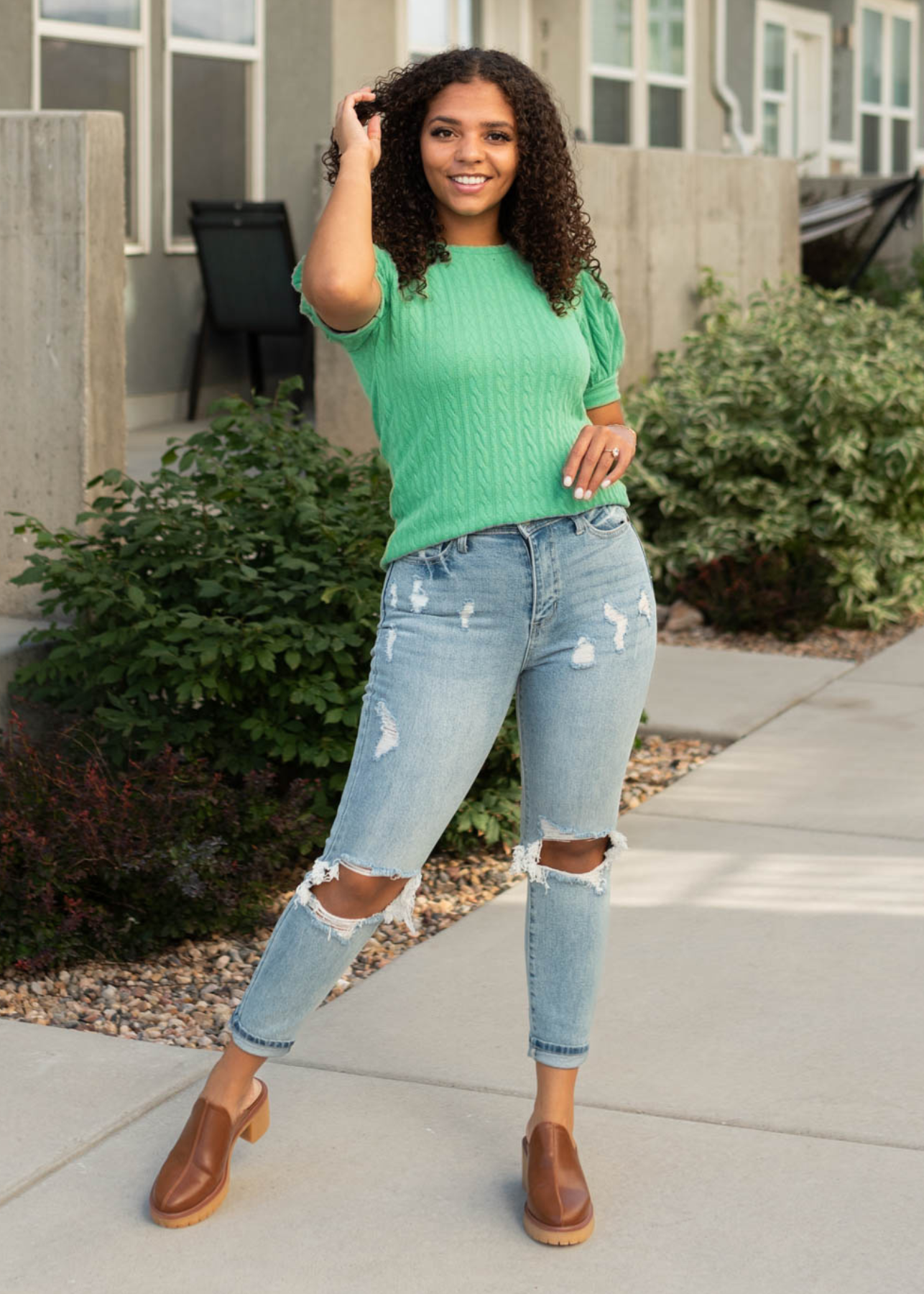 Kelly green top with short sleeves and cuffs