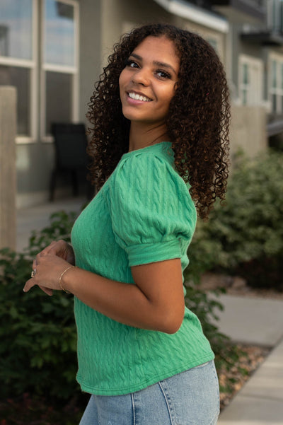 Side view of a kelly green top