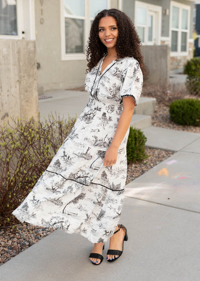 Black print tiered dress with black trim