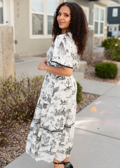 Side view of the black print tiered dress
