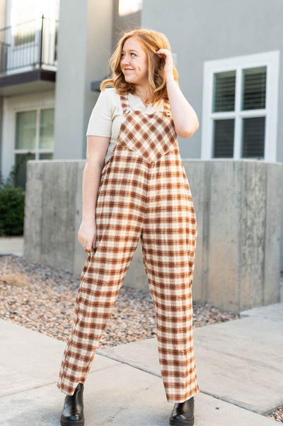 Wide leg camel plaid overalls with buttons on the straps