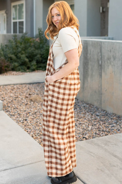 Side view of camel plaid overalls