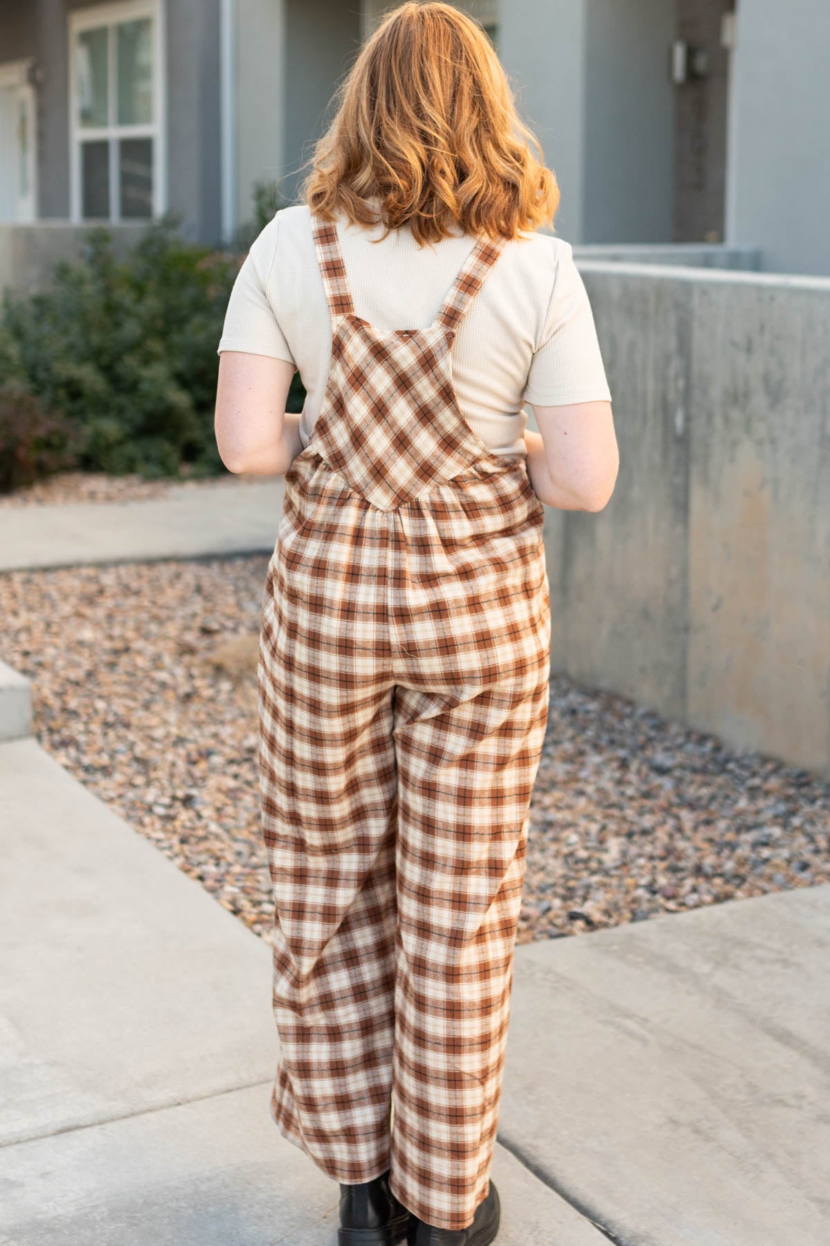 Back view of camel plaid overalls