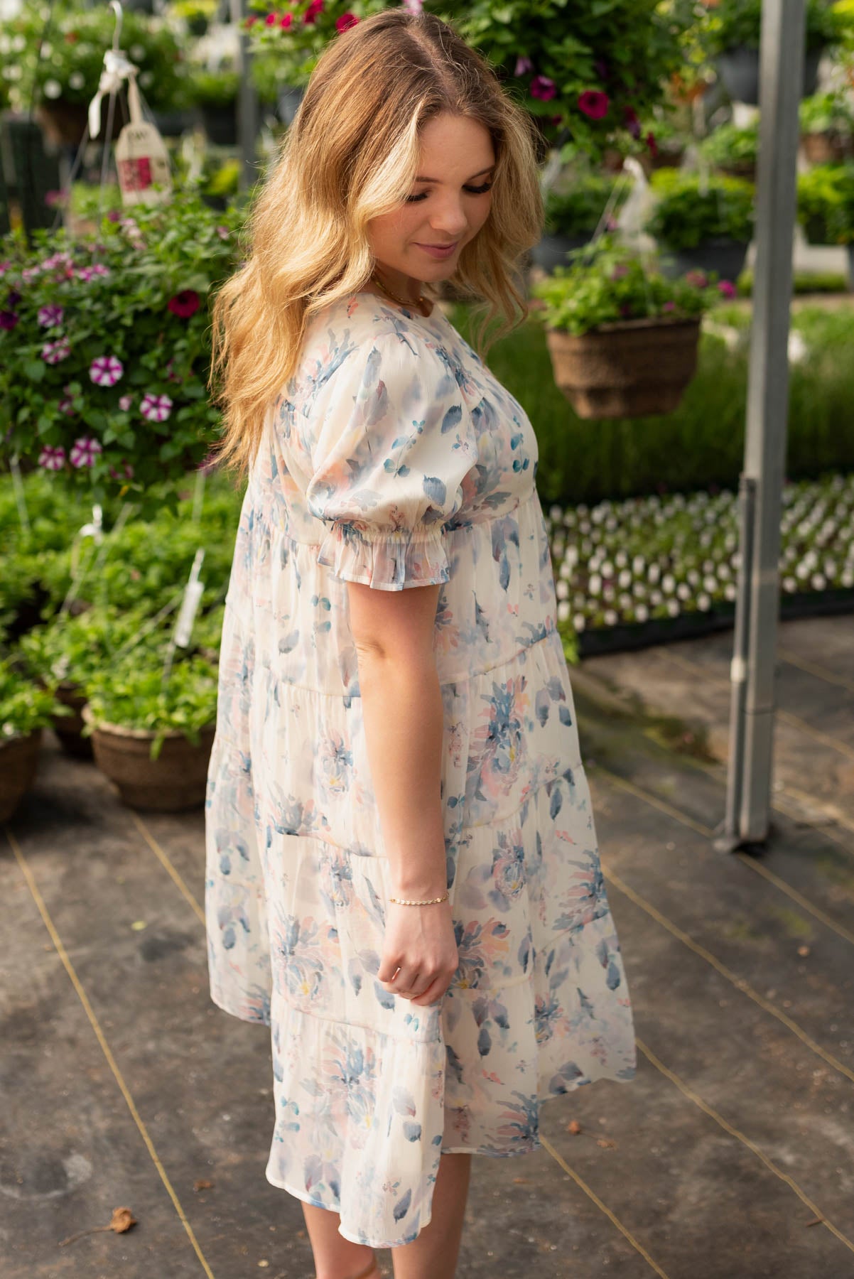 Side view of the blue floral puff sleeve dress