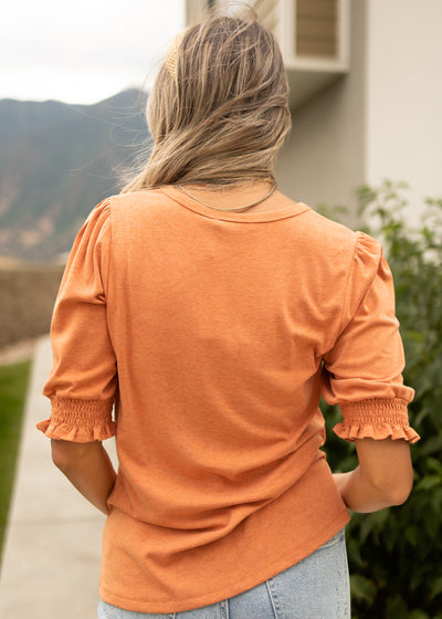 Back view of a short sleeve ginger top