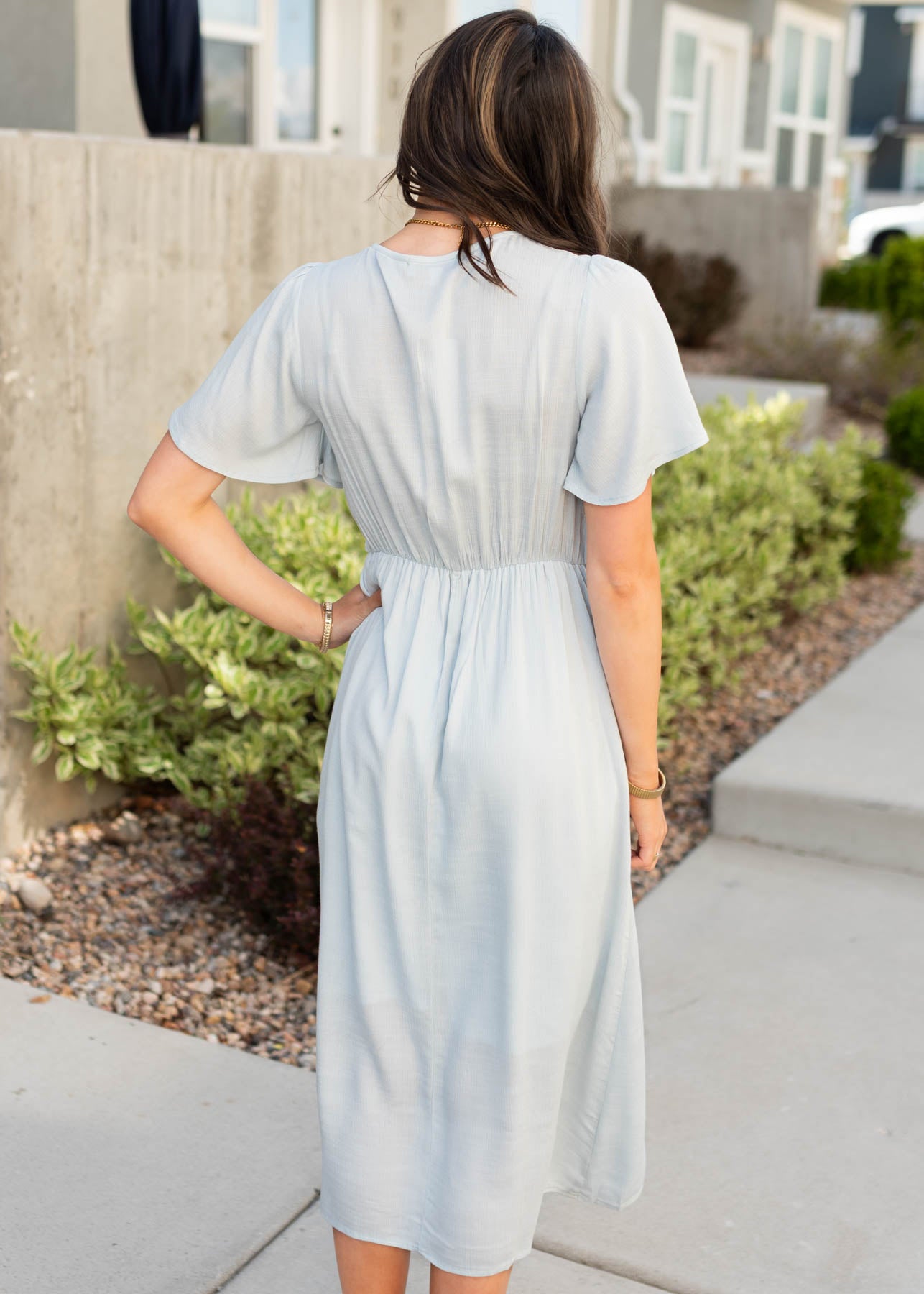 Back view of the dusty blue wrap dress