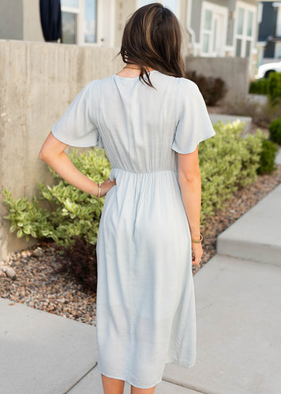 Back view of the dusty blue wrap dress