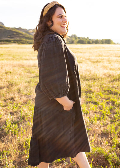 Side view of a plus size black dress