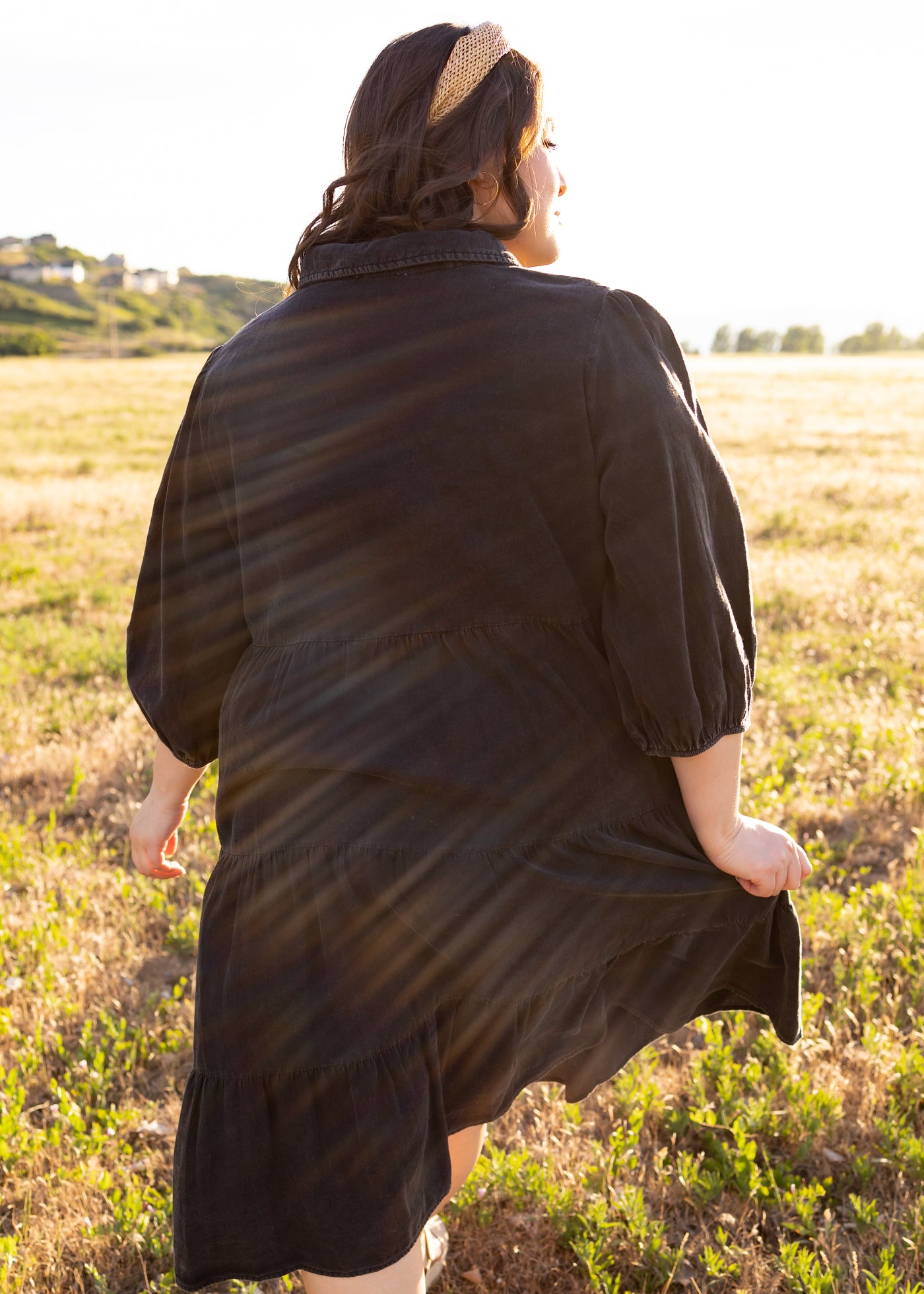 Back view of a plus size black dress