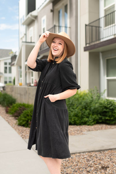Side view of a short sleeve black dress