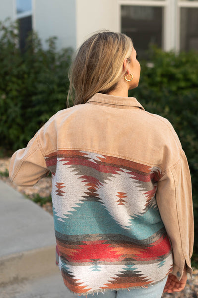 Back view of a khaki denim jacket