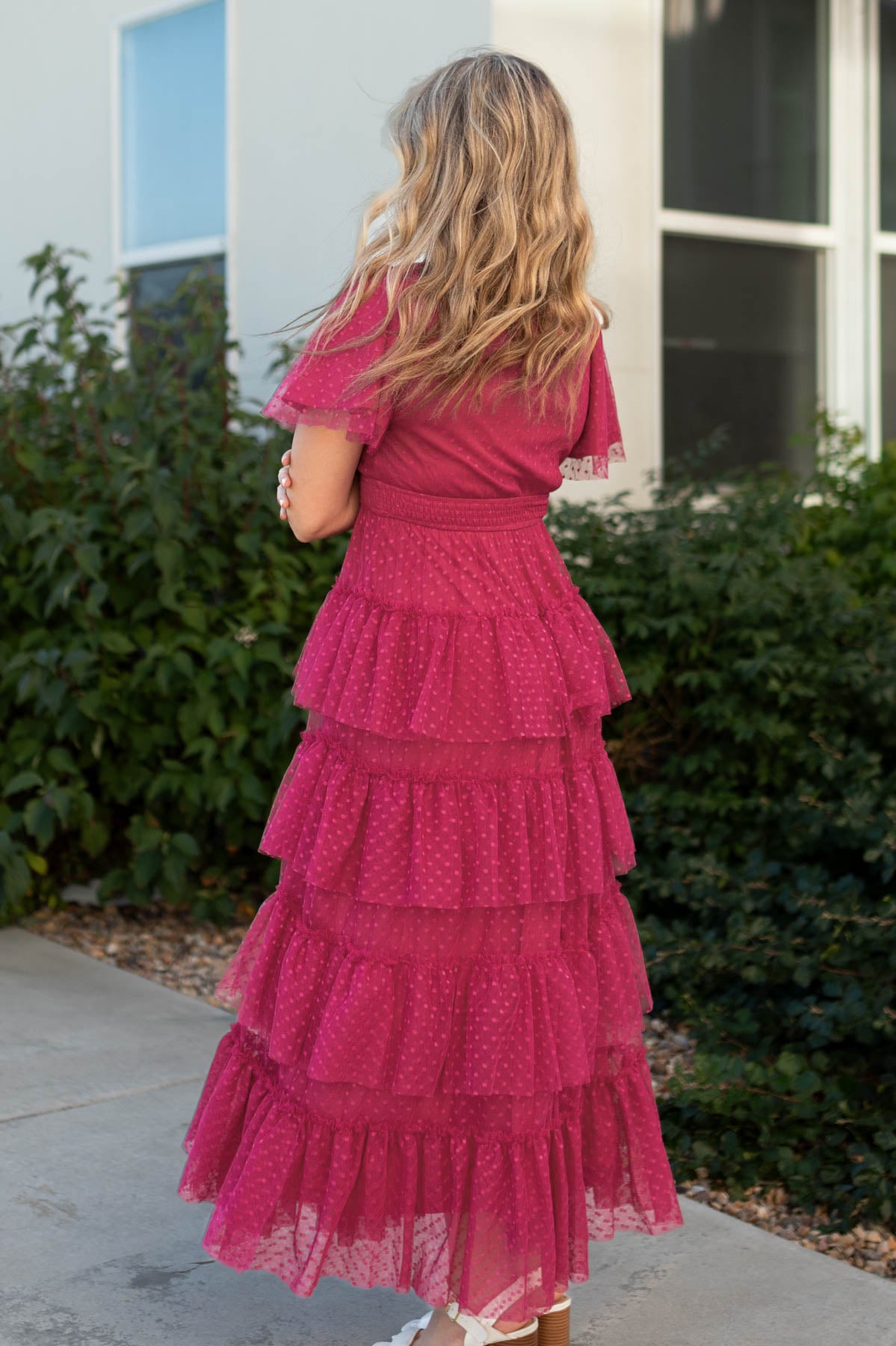 Back view of a magenta dress with ruffles