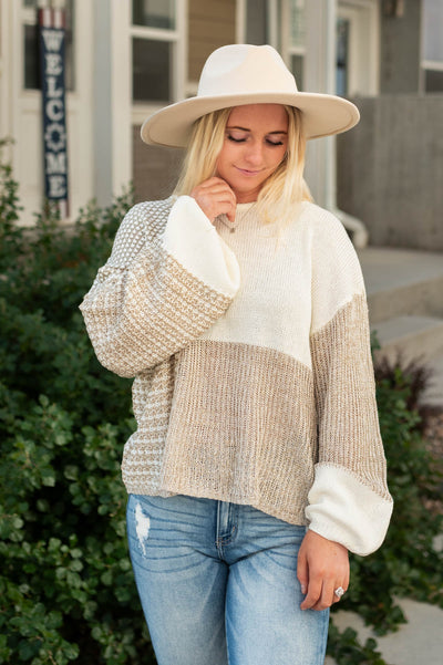 Taupe sweater with block pattern and long sleeves