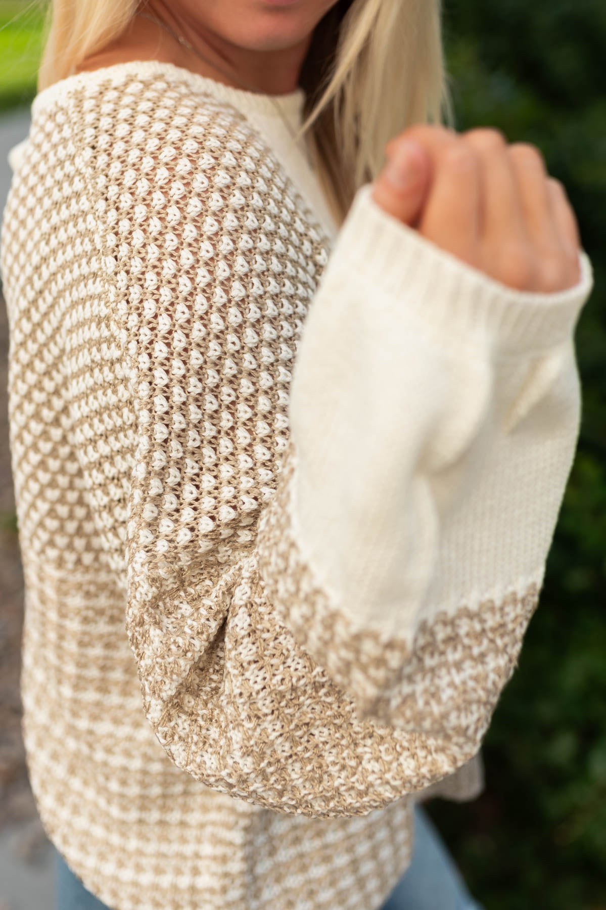 Sweater pattern on a taupe sweater