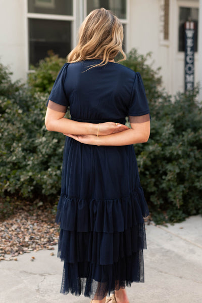 Back view of a navy tiered dress