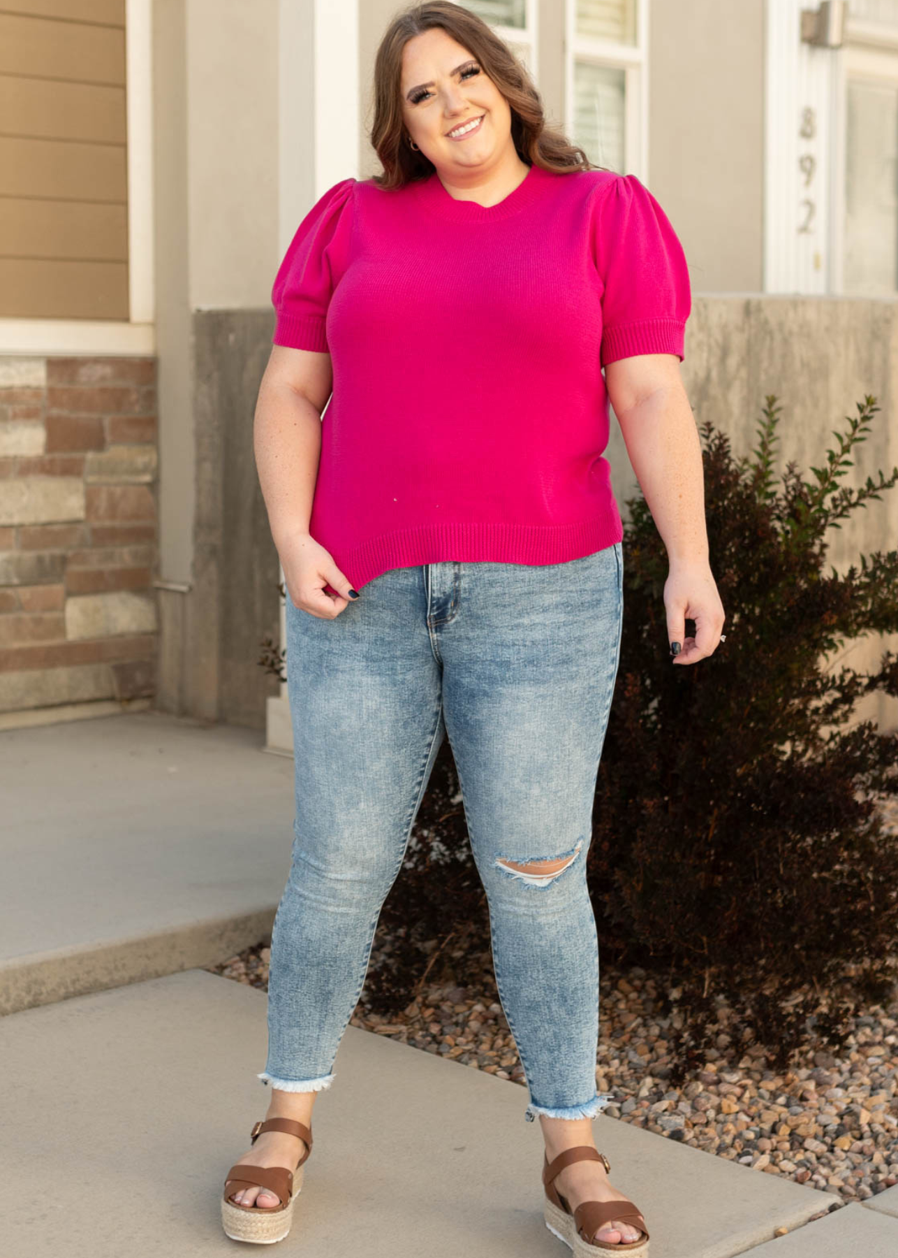 Plus size medium wash jeans with distressed knee