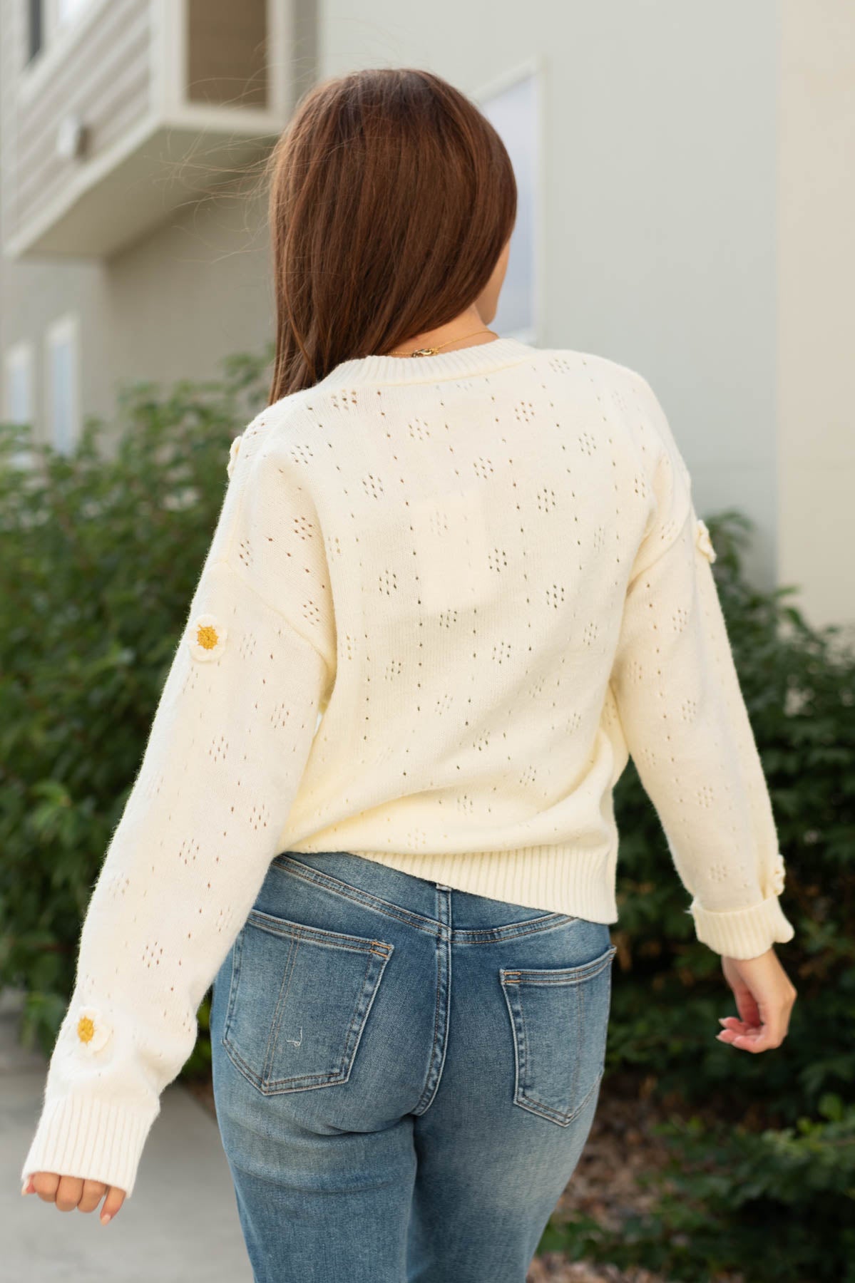 Back view of a ivory cardigan