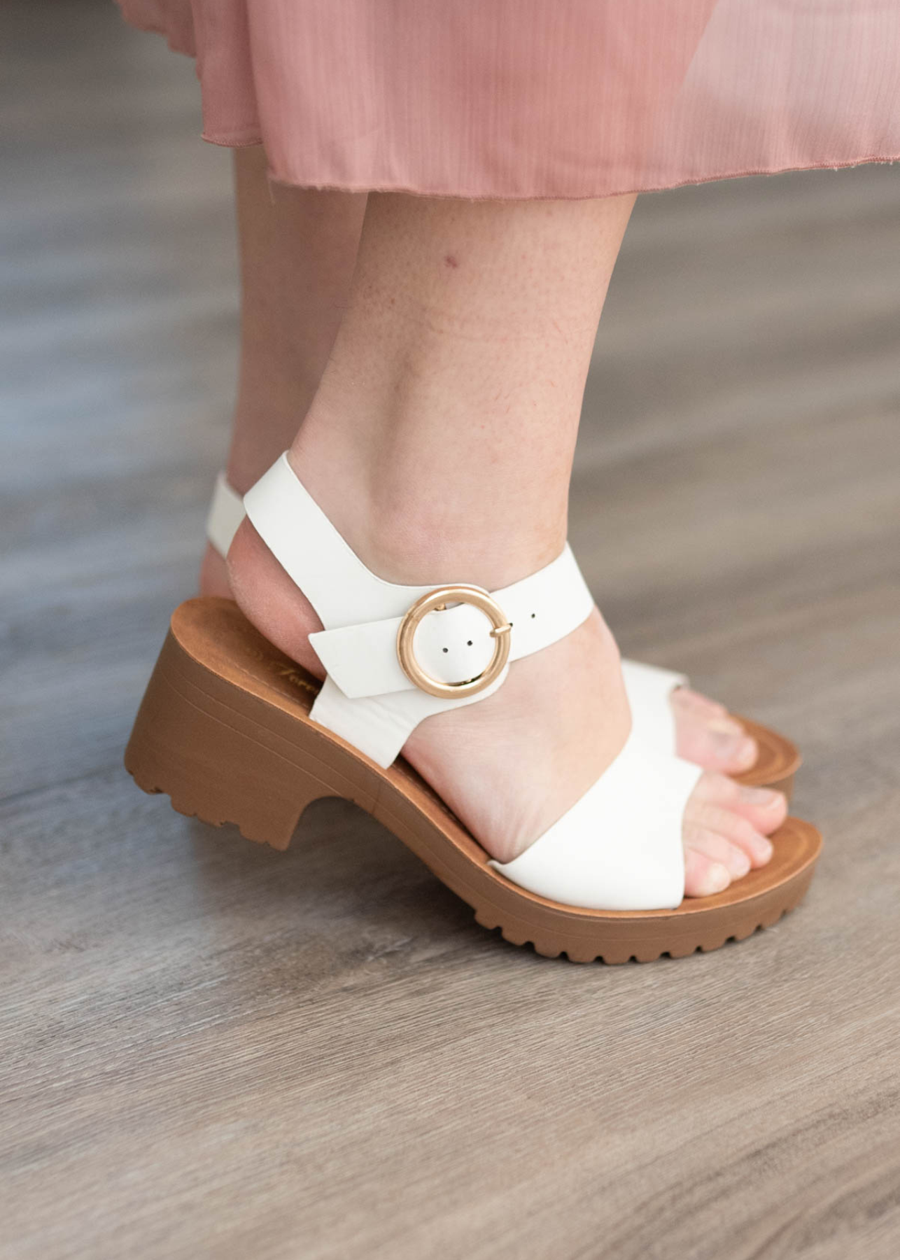 Side view of white sandals with chunky heel