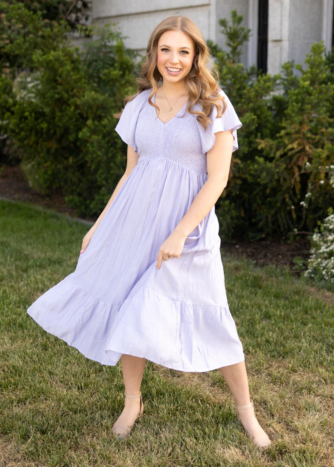 Short sleeve lavender dress with a v-neck and smocked bodice