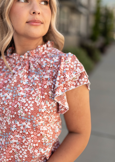 Sleeve of a brick floral top