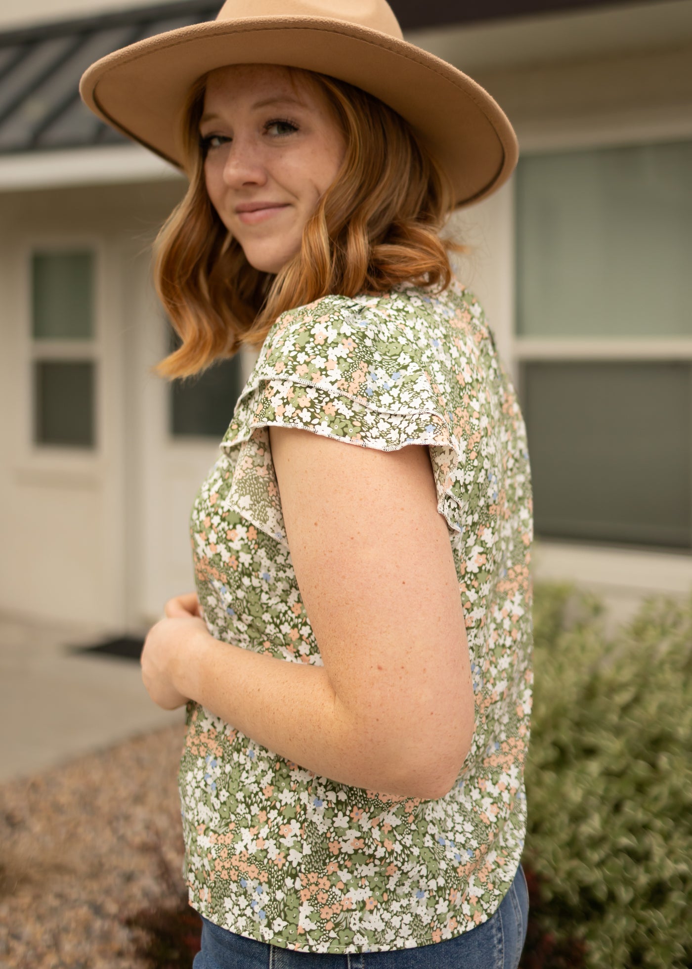 Side view of a green floral top