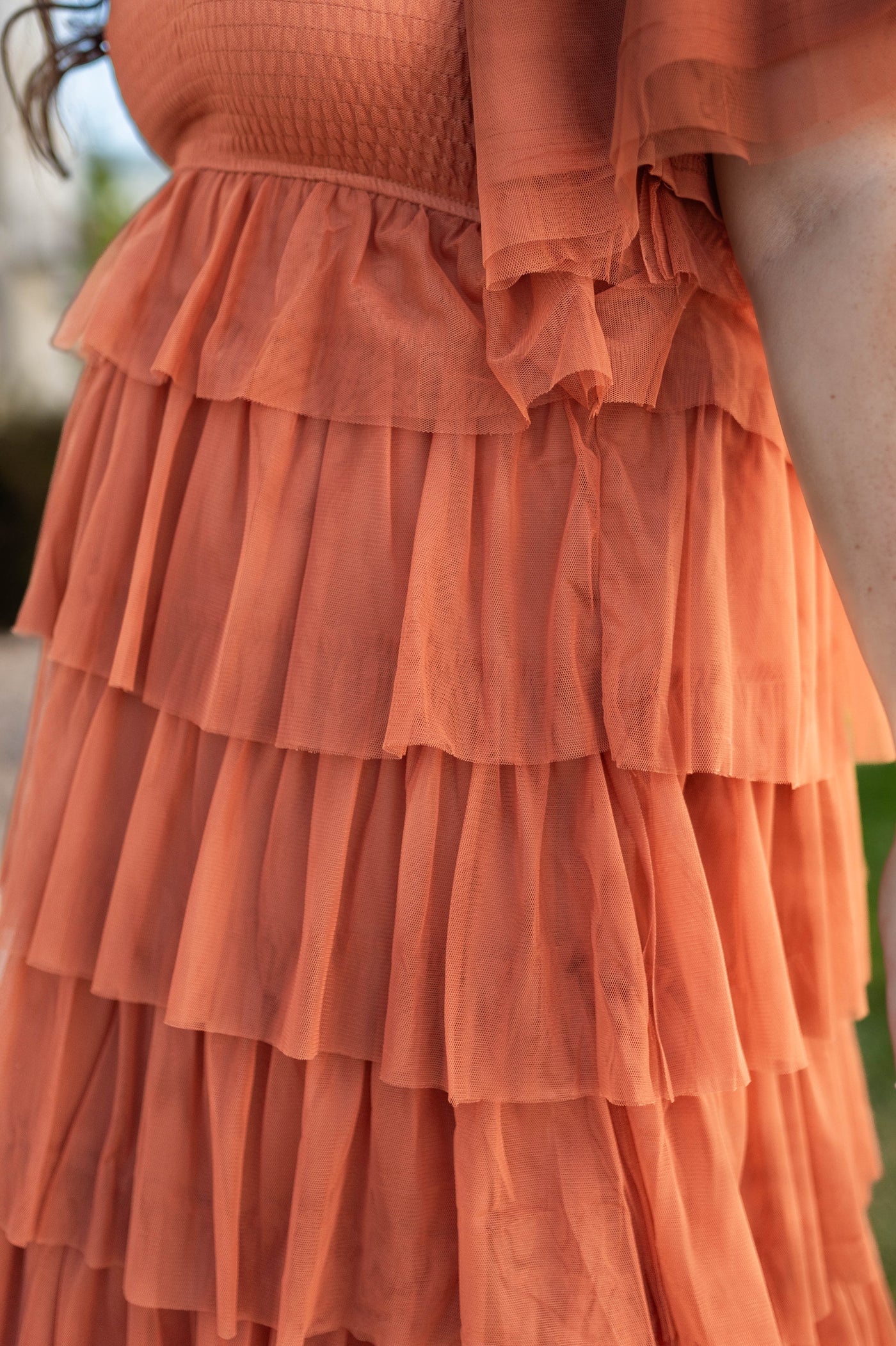 Ruffle skirt of a plus size rust dress