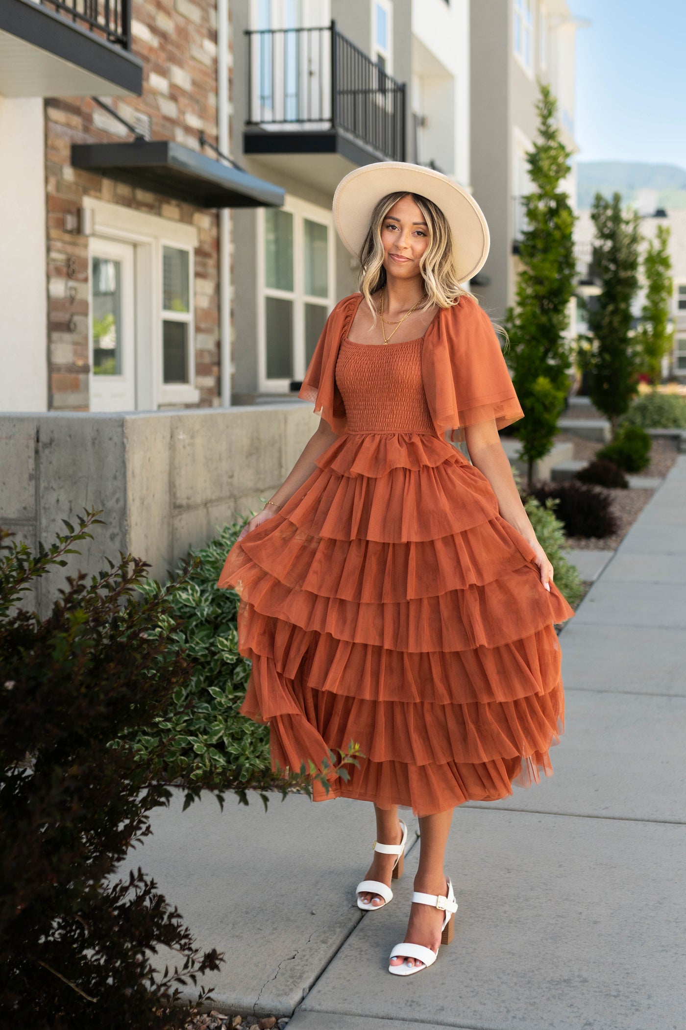 Rust dress with square neck, short sleeves and tulle ruffle skirt