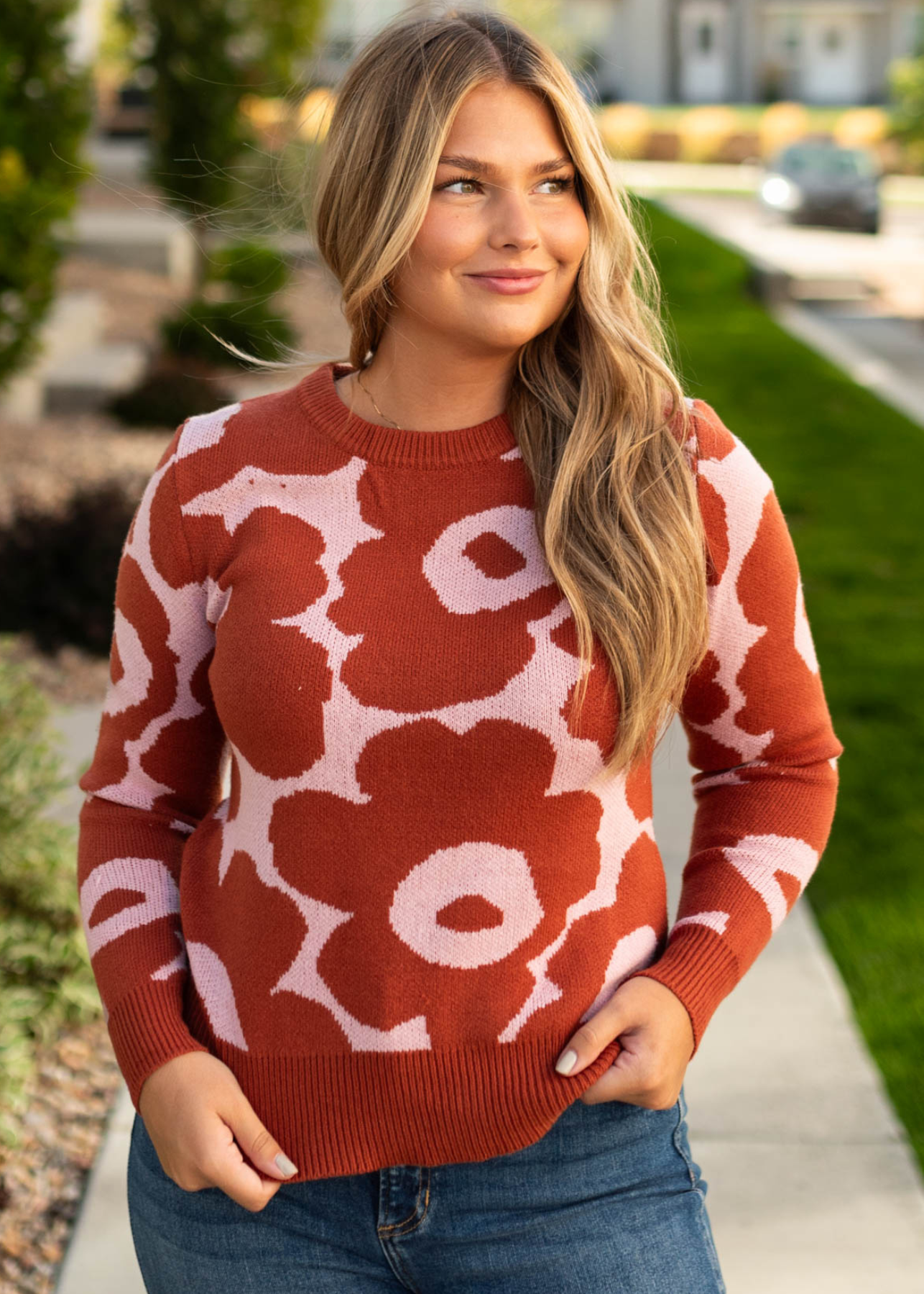 Rust sweater with blush background