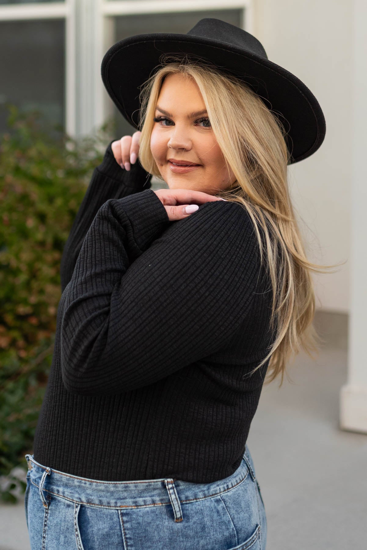 Side view of a plus size black top