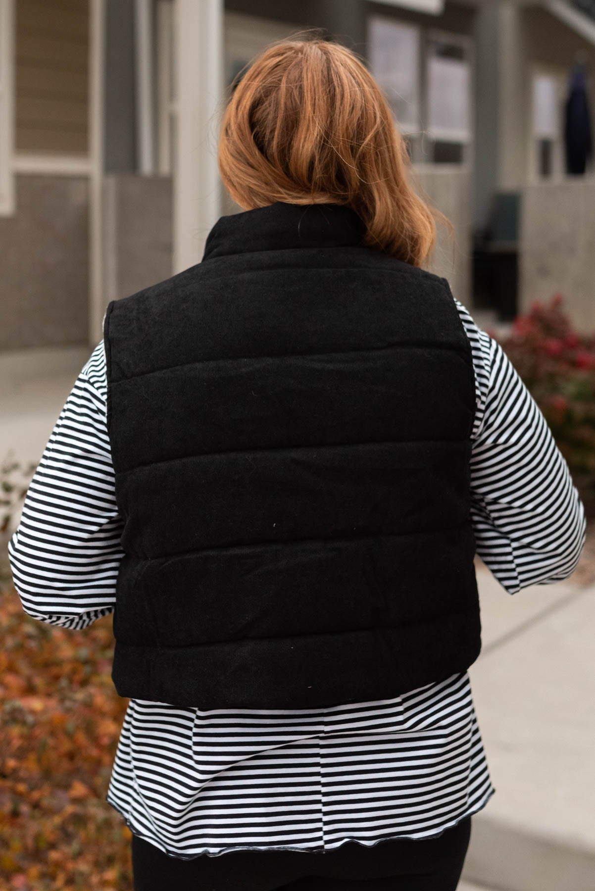 Back view of the black corduroy vest