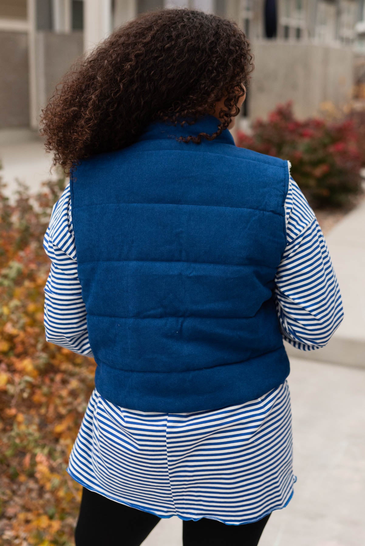 Back view of the blue corduroy vest