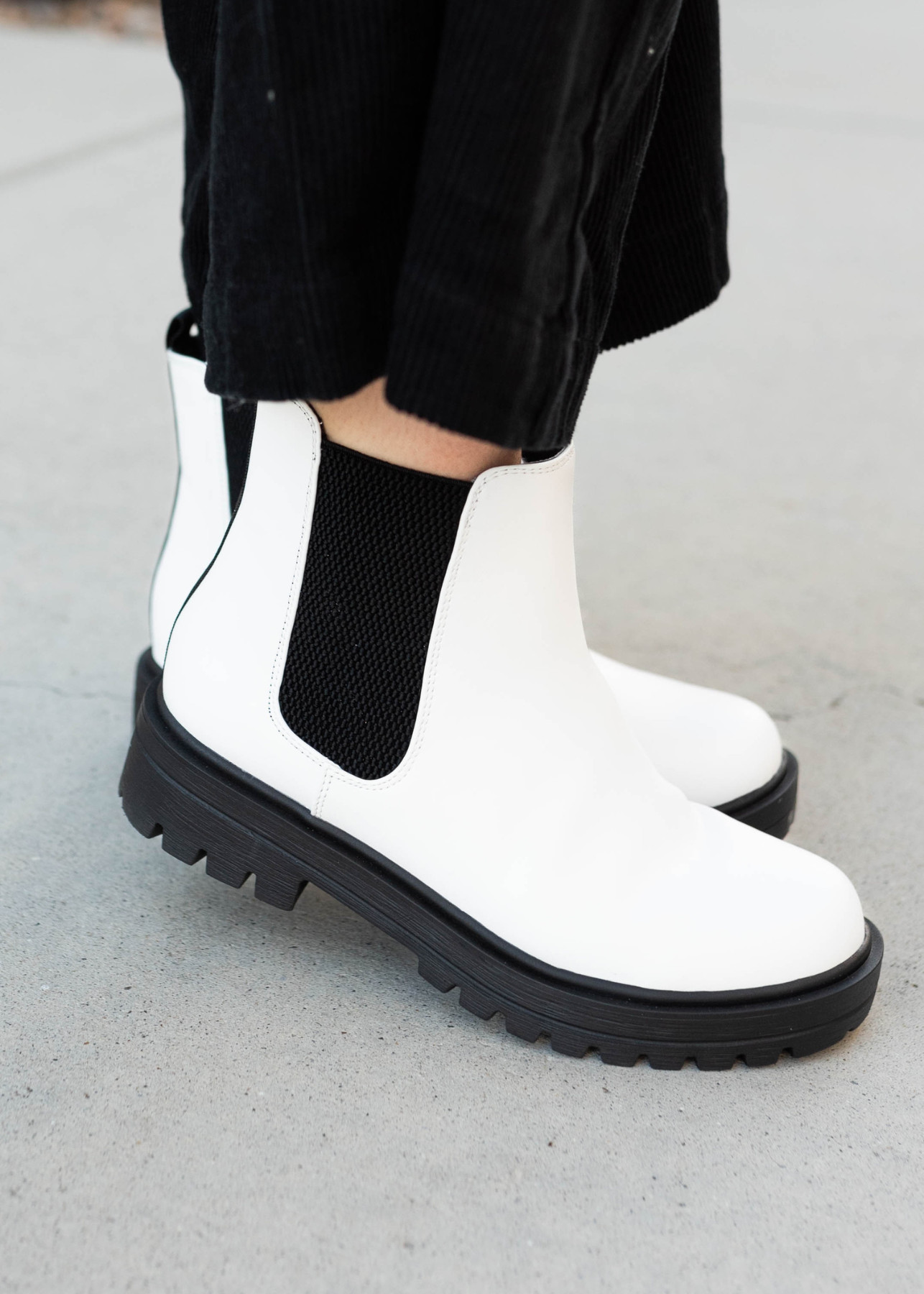 Side view of the white Chelsea  boots
