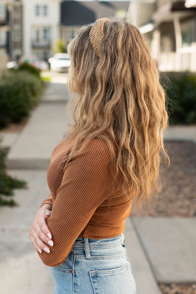 Side view of a brown bodysuit